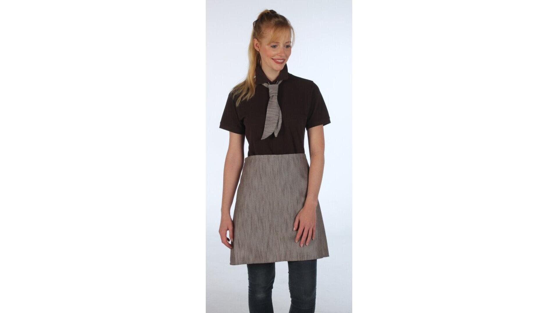 A woman with blonde hair in a ponytail wears a dark short-sleeved shirt, a pinstriped apron dress, and a striped tie. She is standing and looking slightly to the side, smiling.