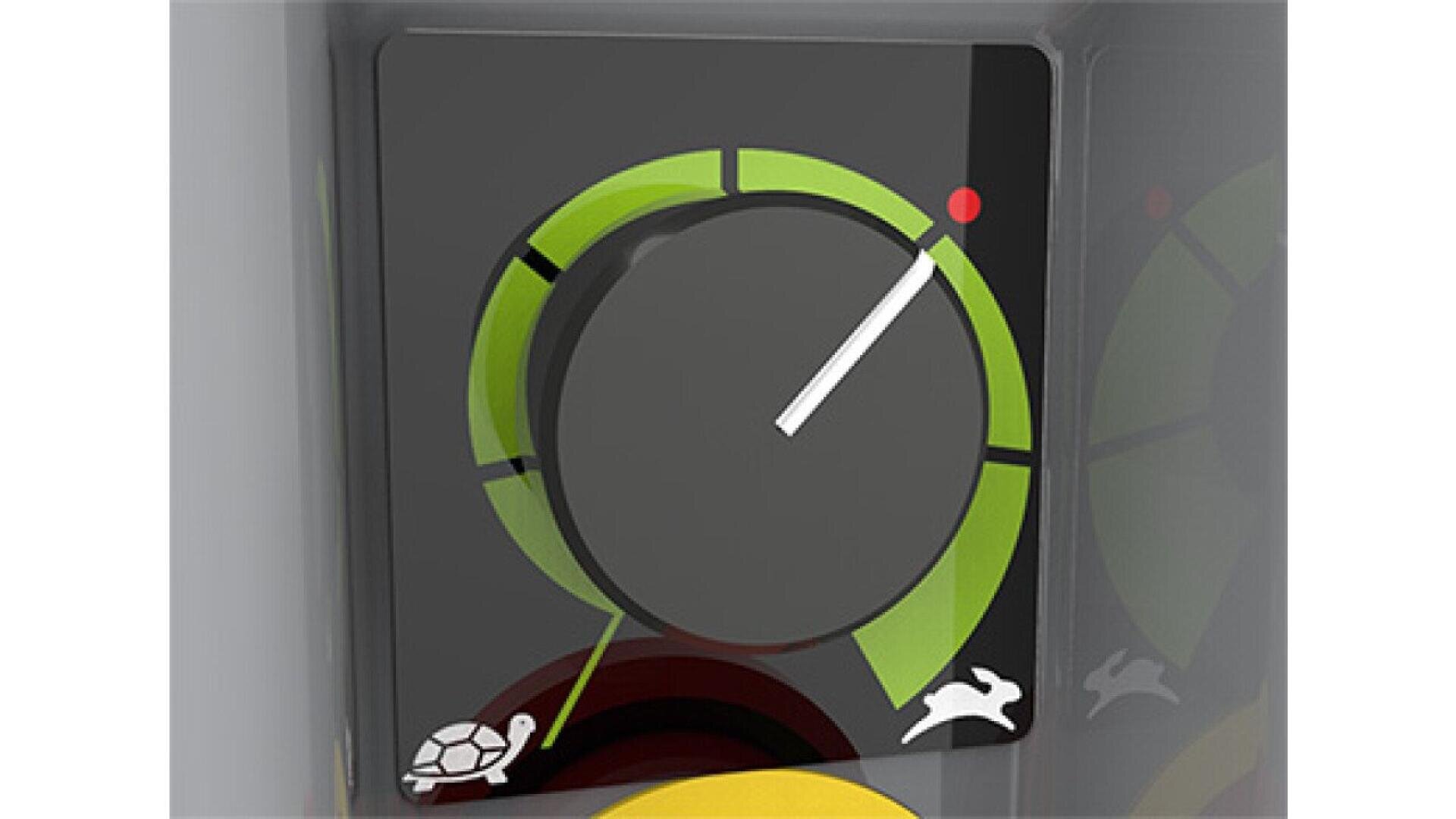 A close-up of a control dial featuring a white needle pointing to the higher end. The dial has green and yellow segments, with a turtle icon on the left and a rabbit icon on the right, indicating speed settings.