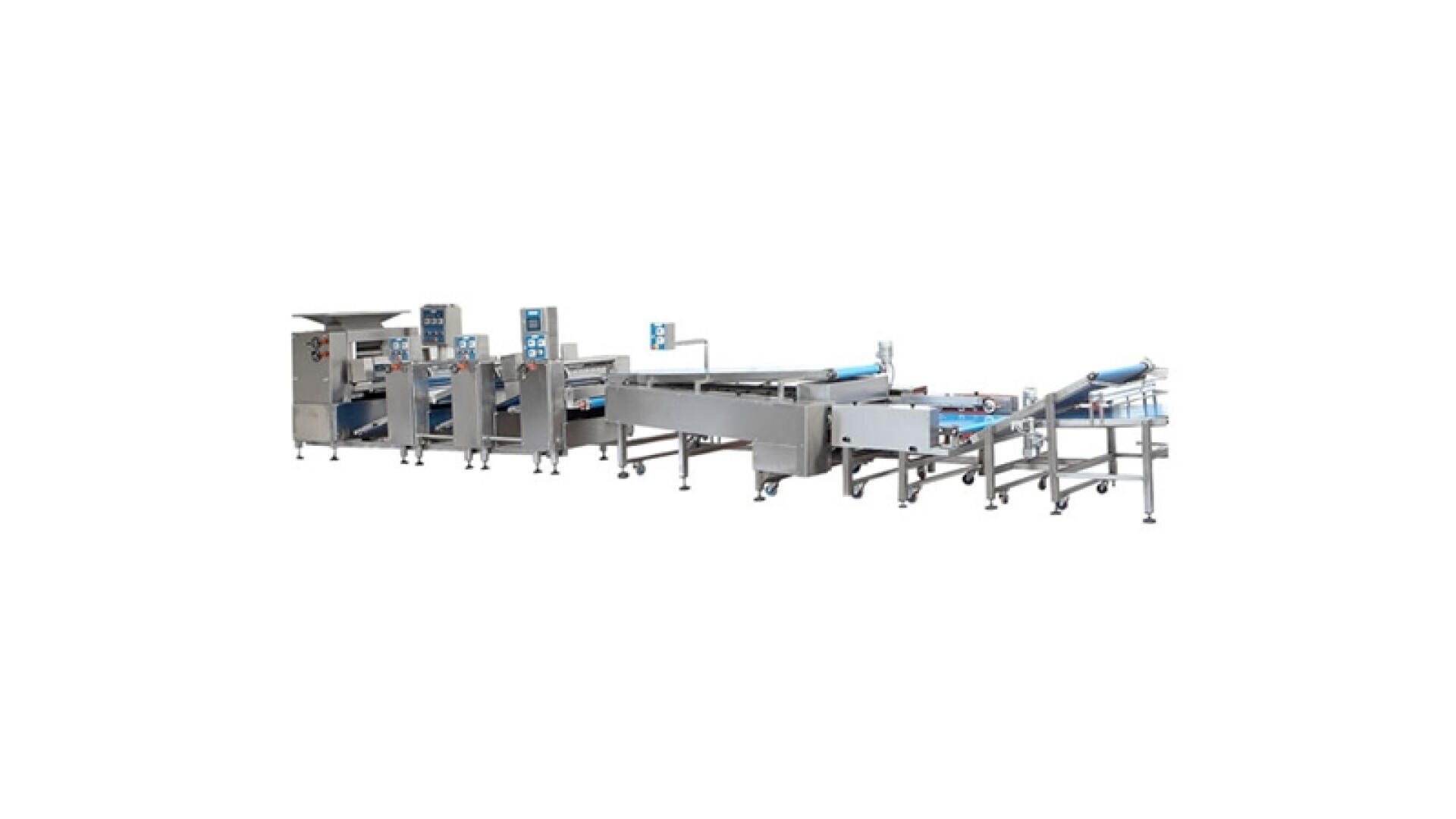A long industrial food processing machine made of stainless steel with several conveyor belts, control panels and sections, designed for automated production in a factory.