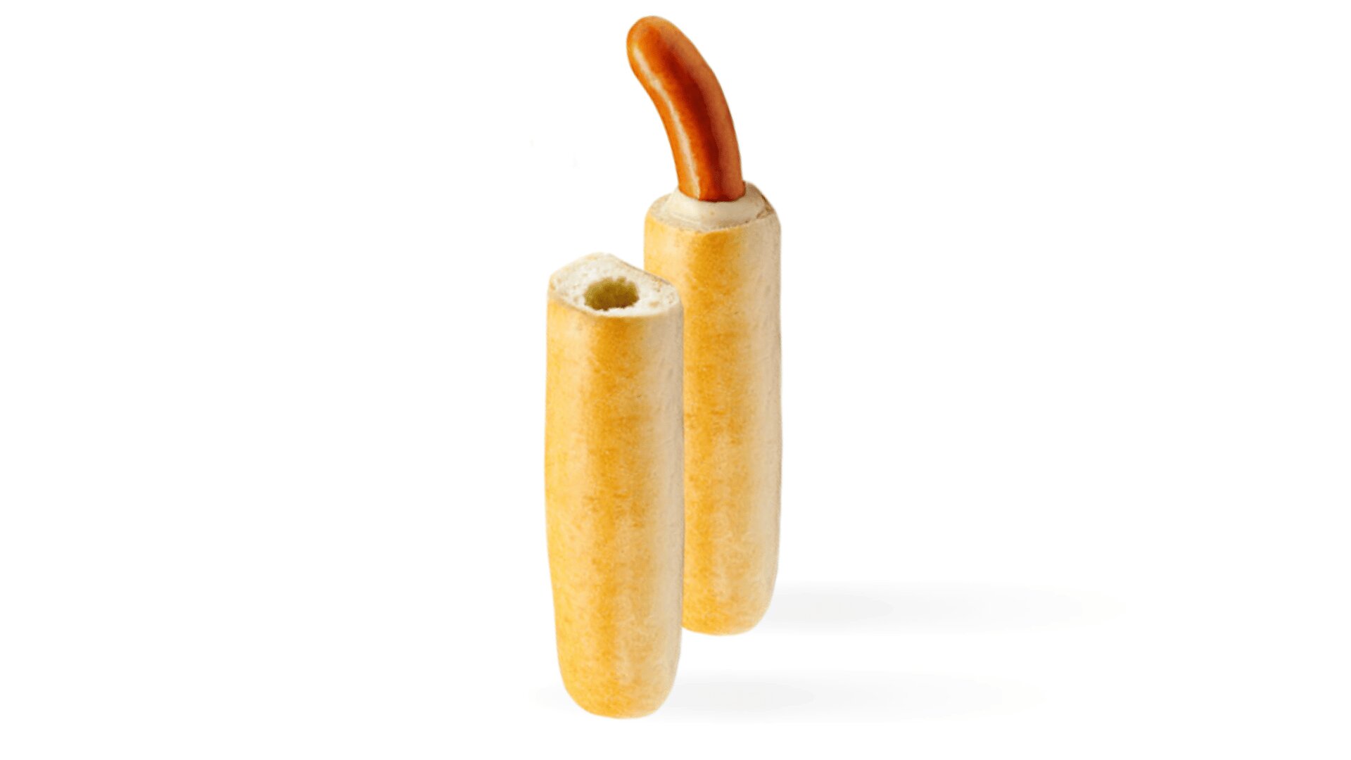 Two baguette-style bread rolls stand upright; one is whole, while the other has a piece of sausage sticking out from the top. The background is plain white.