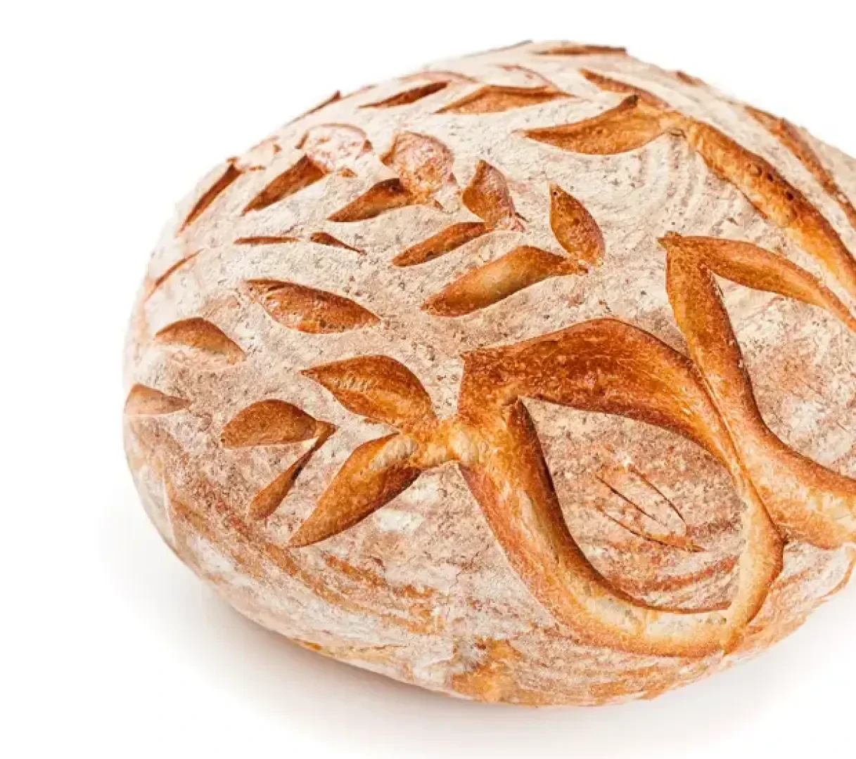 Round loaf of artisan bread with a golden-brown crust, featuring decorative leaf and branch patterns scored into the surface. The bread is set against a white background.