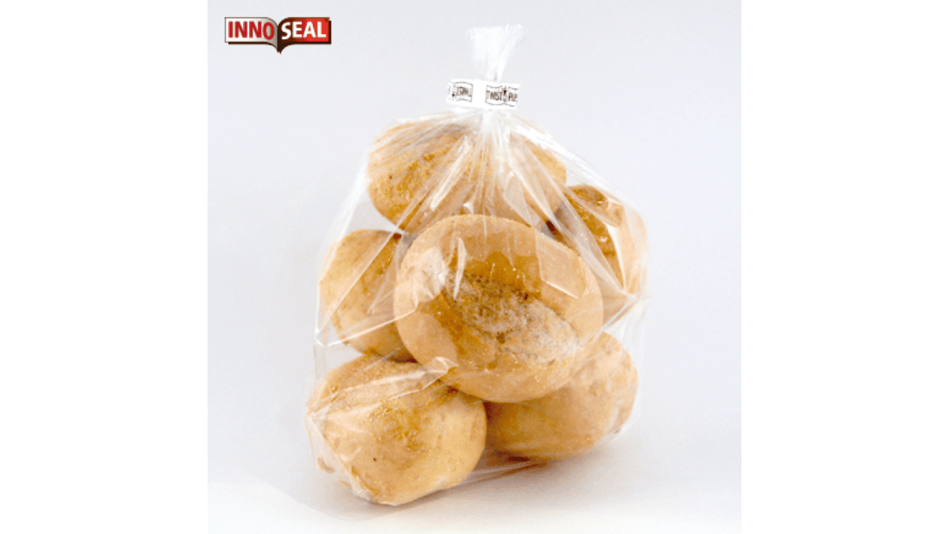 Eine klare Plastiktüte enthält mehrere runde Brötchen, die oben mit einem weißen Clip verschlossen sind. Die Tüte zeigt das InnoSeal-Logo in der oberen linken Ecke auf einem schlichten weißen Hintergrund.
