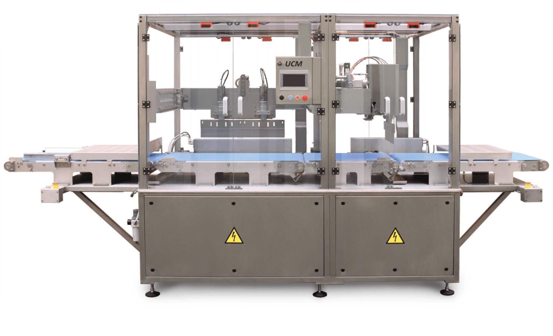 A stainless steel industrial packaging machine with a transparent enclosure, control panel, conveyor belts on both sides, and yellow caution signs on the lower panels.