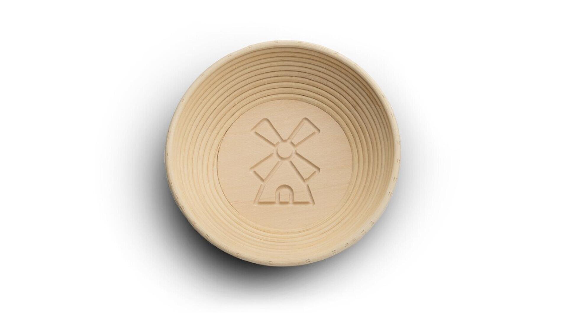 A round, light-colored wooden bowl with concentric ridges and an engraved windmill design on the flat base, viewed from above against a white background.