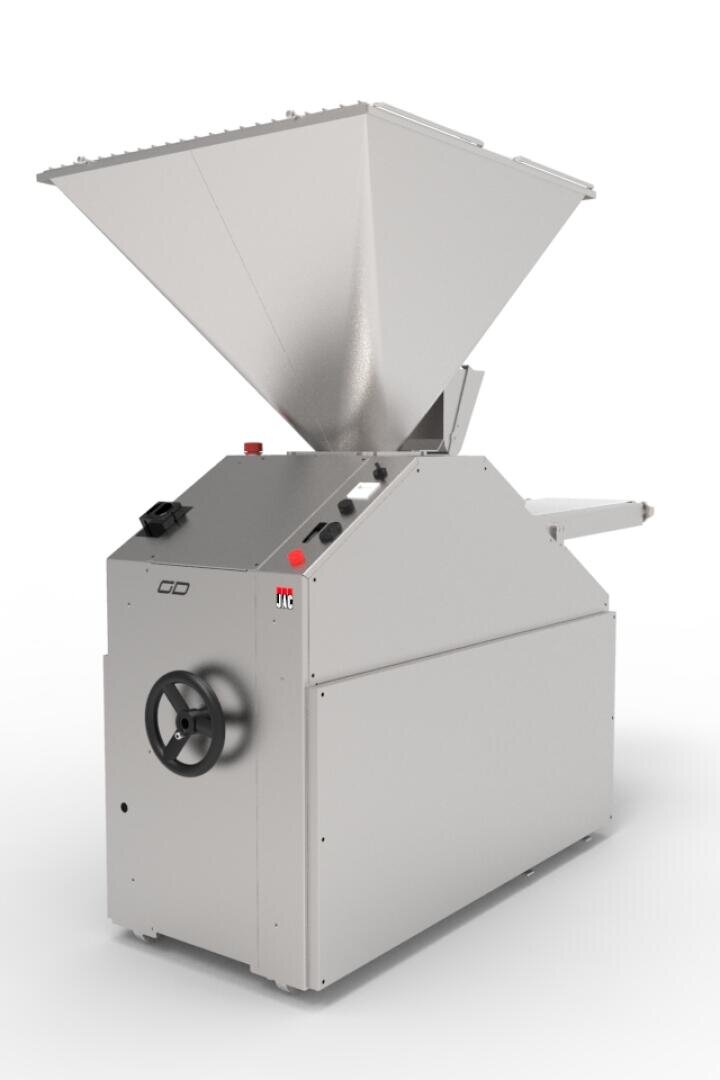 A large industrial stainless steel machine with a wide funnel-shaped hopper on top, control buttons, and a hand wheel on the side, designed for food or material processing.