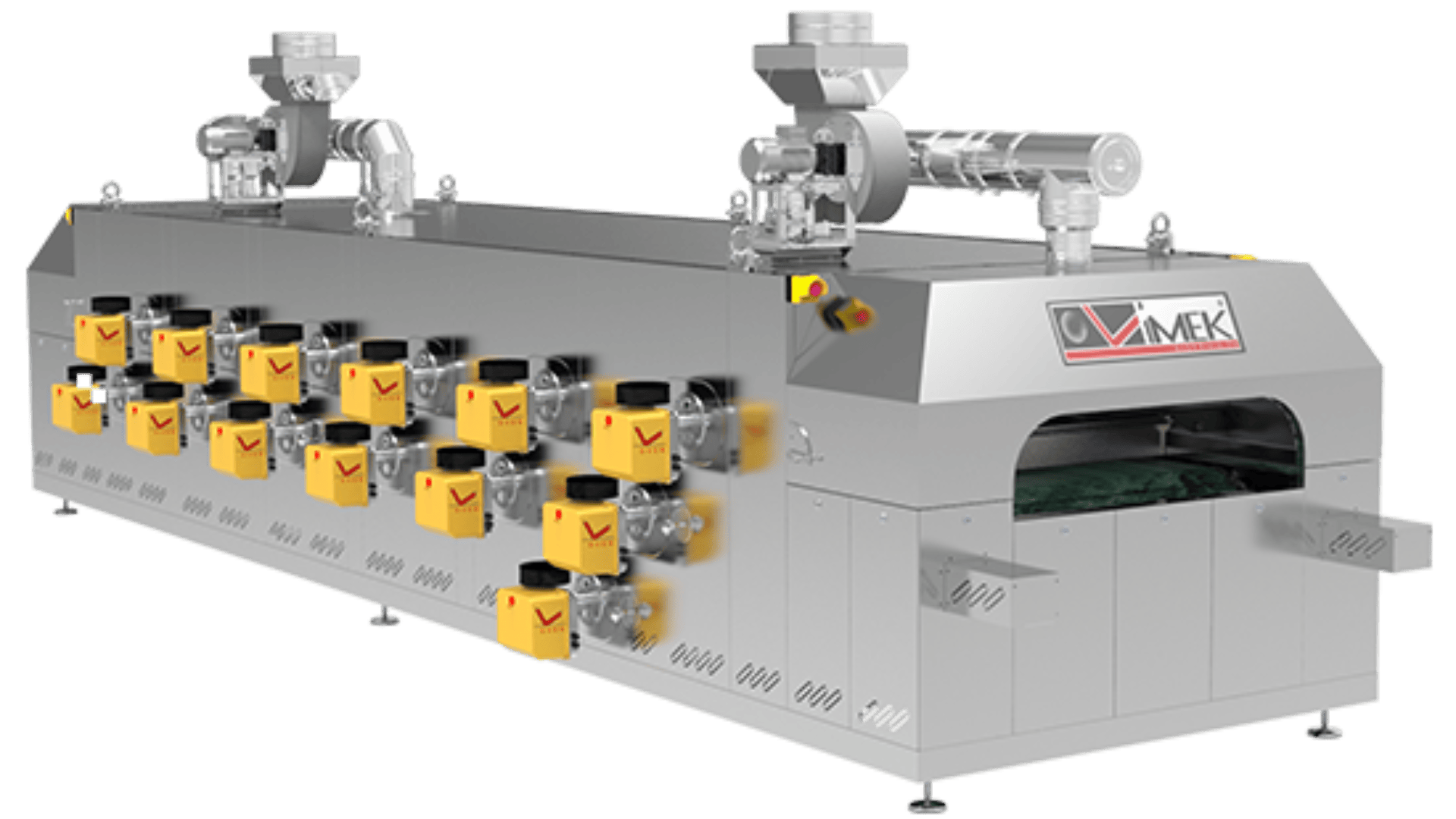 A large stainless steel industrial machine with several yellow control boxes and two motors on top, with inlet and outlet openings at both ends, used for processing food or materials.