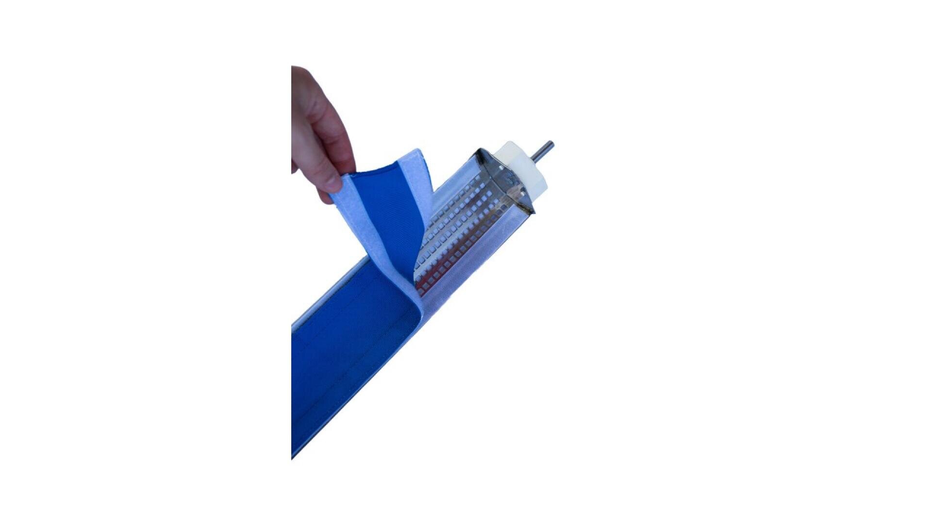 A hand is peeling back a blue and white cover from a long, cylindrical LED light fixture. The light is partially exposed, revealing the LED strip and electrical components inside.