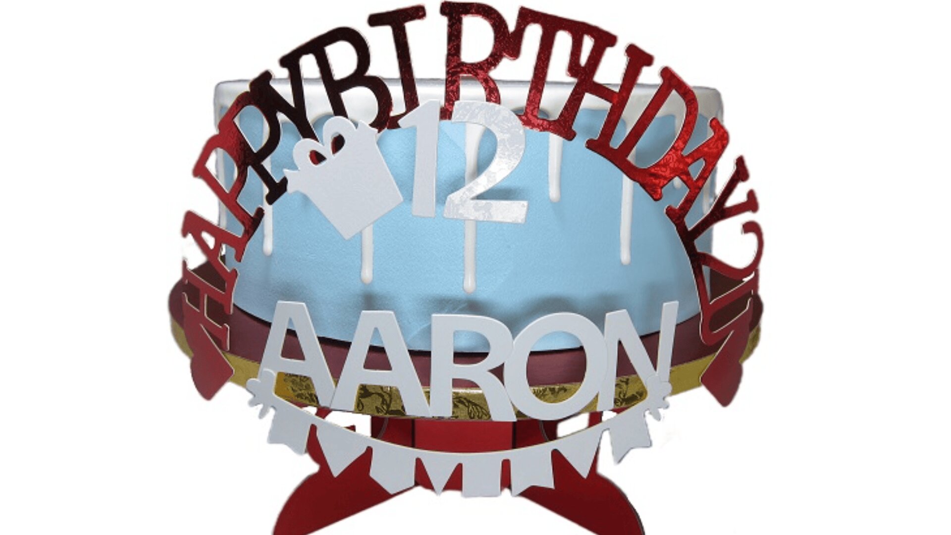 A blue birthday cake with white icing drips features a decorative topper that reads Happy Birthday Aaron and displays the number 12 with a small gift icon.